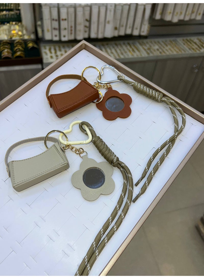 A stylish heart-shaped bag and keychains in assorted colors - Image 3